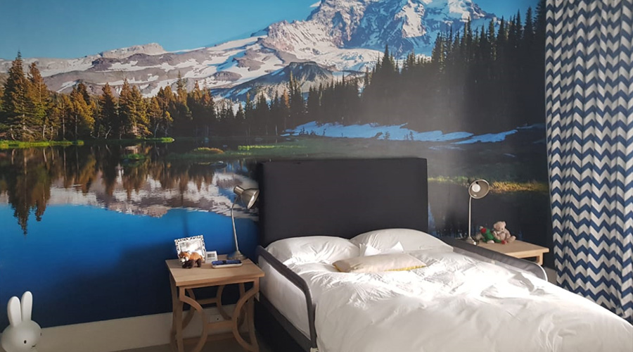 guest bedroom or kids bedroom with photographic wallpaper of stunning mountain and lake view